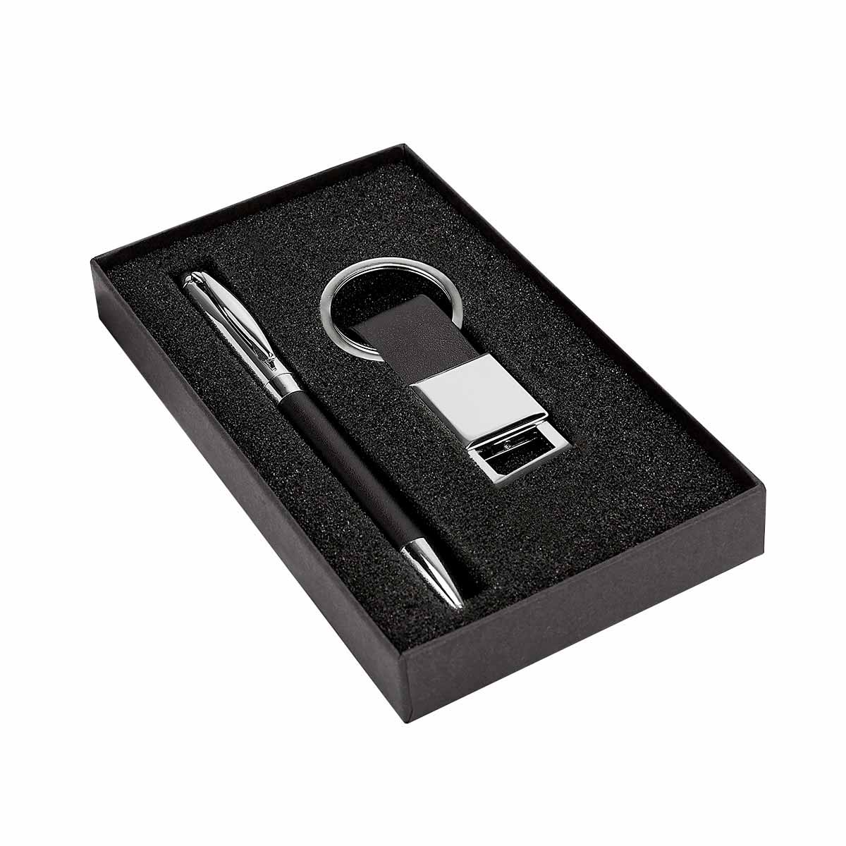 Kit ejecutivo personalizado con bolígrafo metálico, llavero de curpiel y caja de regalo para empresas.
