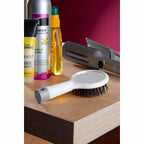 Cepillo para cabello anti-frizz con masajeador y espejo integrado, personalizado para marcas de belleza.