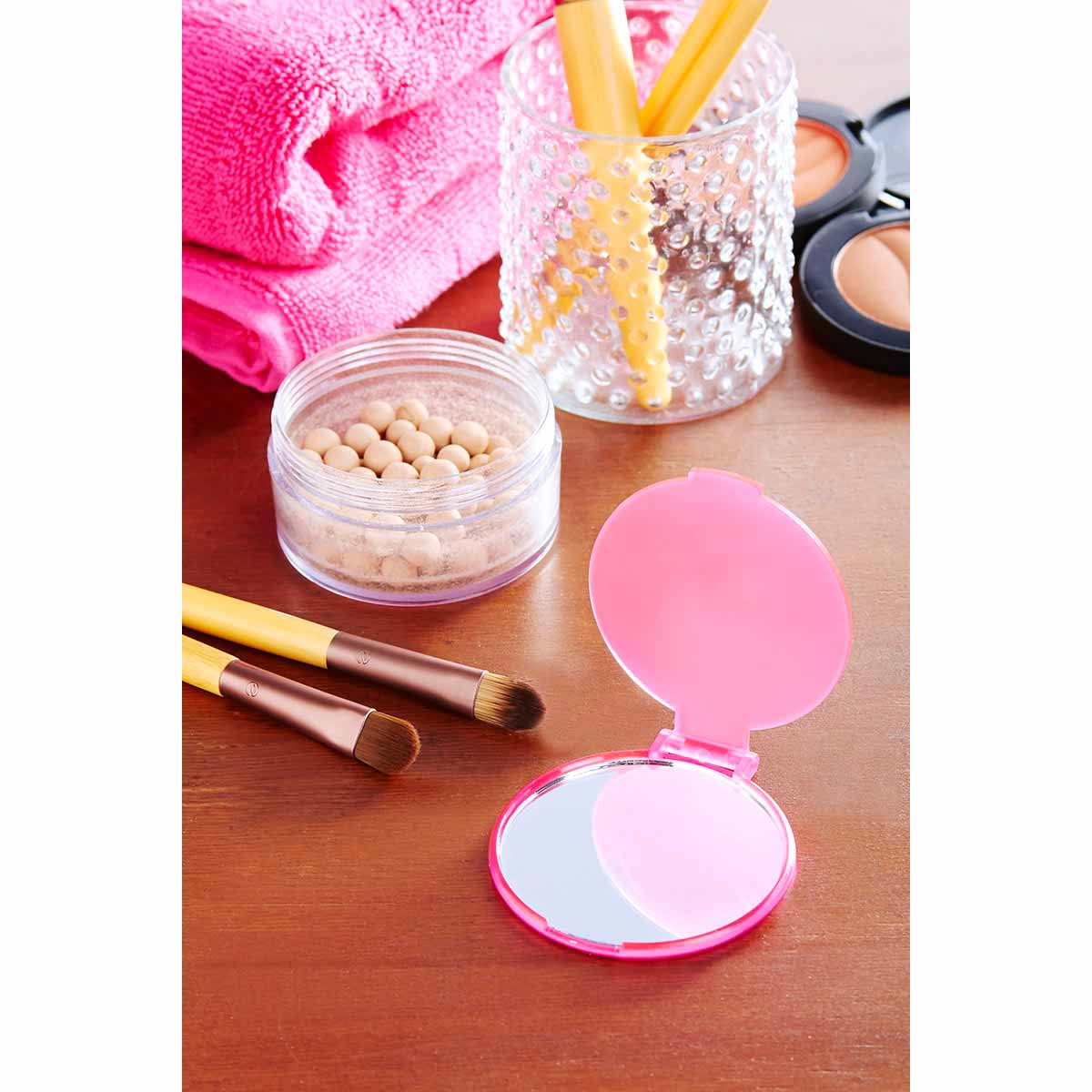 Espejo circular de bolsillo de plástico de 6 cm de diámetro personalizado para marcas de belleza.
