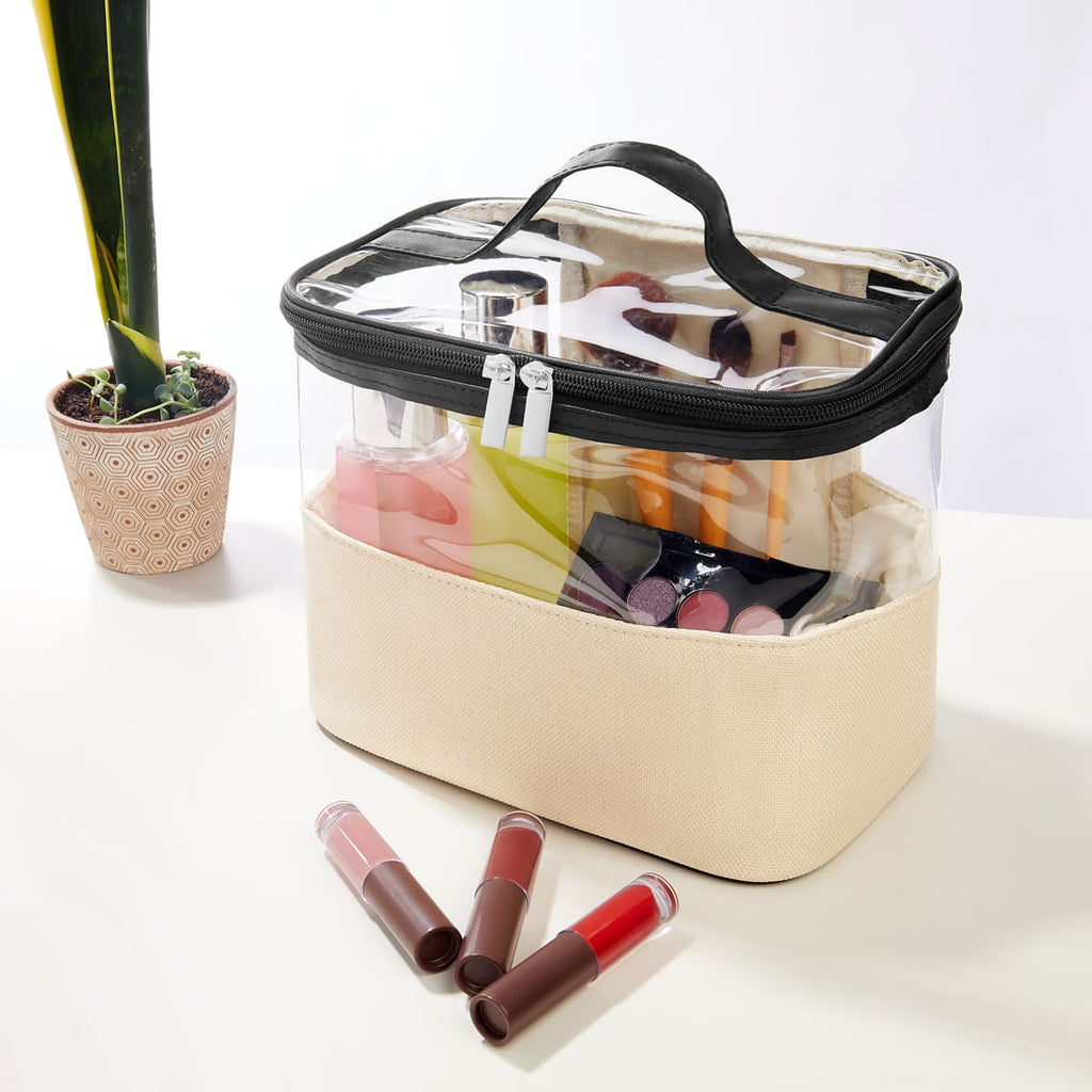 Cosmetiquera personalizada con ventana frontal transparente, base de yute y asa de curpiel para productos de belleza.