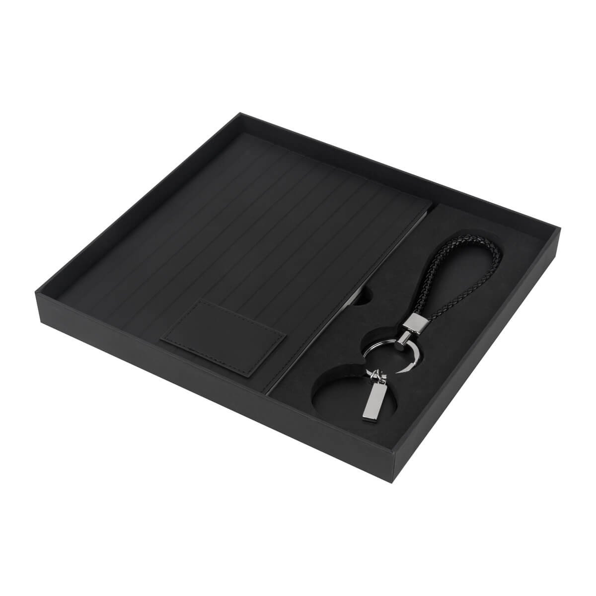 Kit ejecutivo personalizado con libreta de curpiel, llavero premium y caja de regalo para empresas.