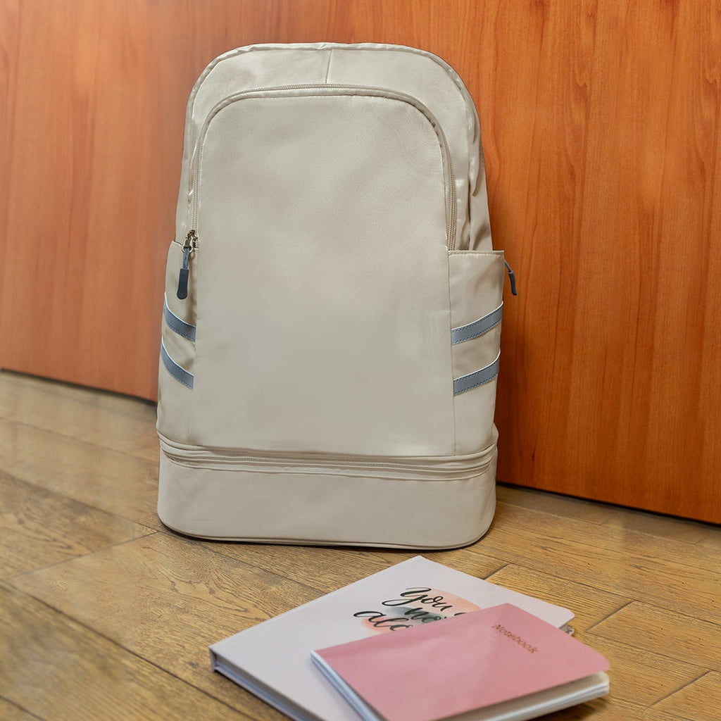 Mochila deportiva promocional personalizada con compartimento para calzado y bolsillo impermeable para ropa húmeda.