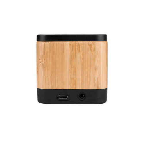 Bocina Bluetooth personalizada con cargador inalámbrico y acabado en bambú para regalos corporativos y promocionales tecnológicos.
